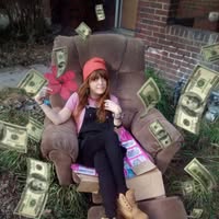 A loved one sitting in a chair with prop money