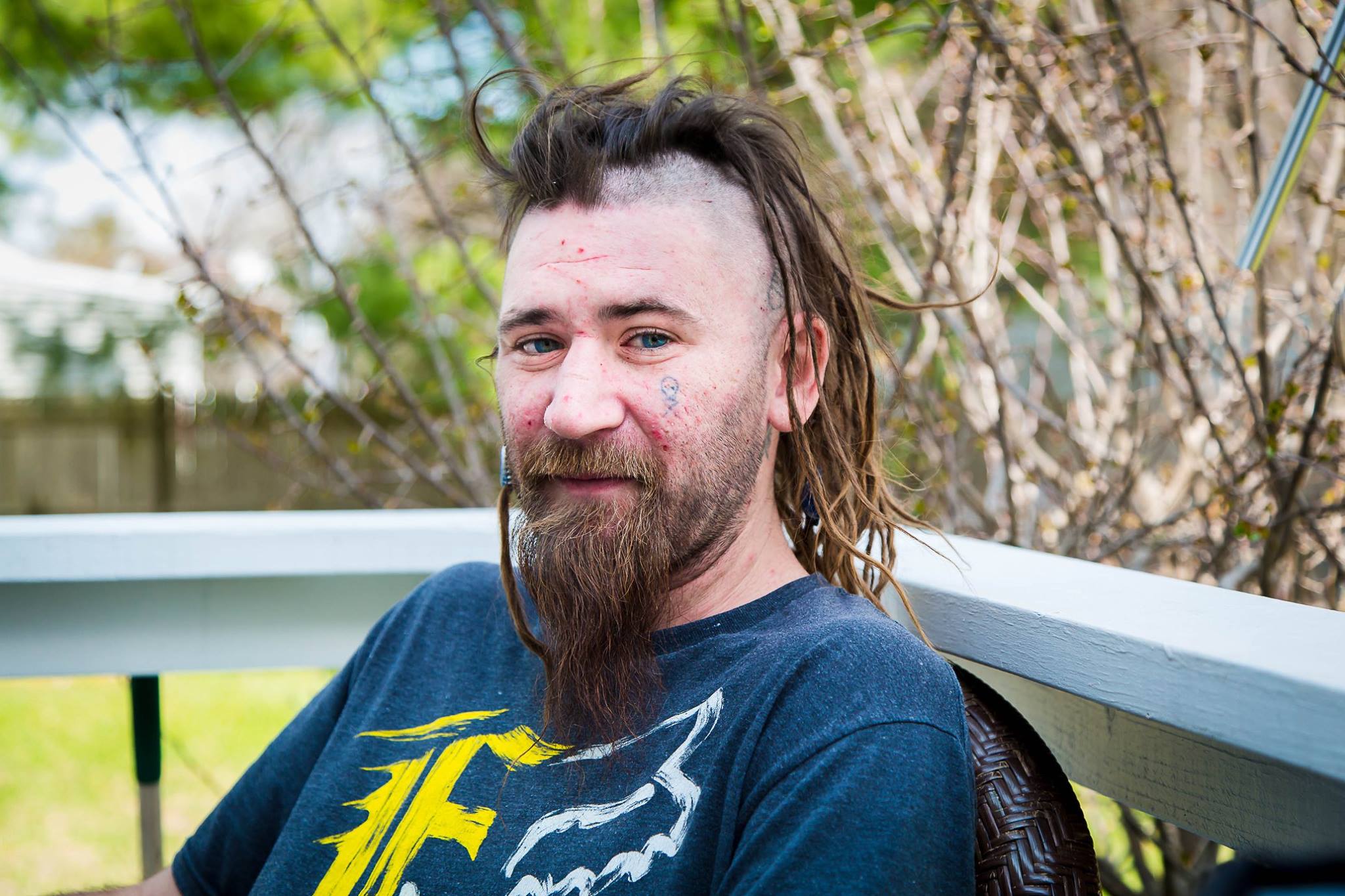 A close portrait of a loved one sitting outside