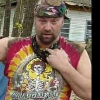 A loved one wearing a colorful sleeveless shirt outdoors
