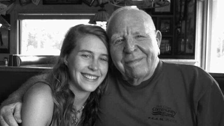 Two loved ones smiling together in a black and white photo