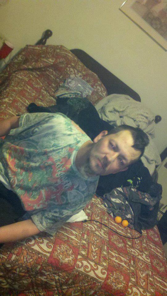A loved one sitting on a bed indoors