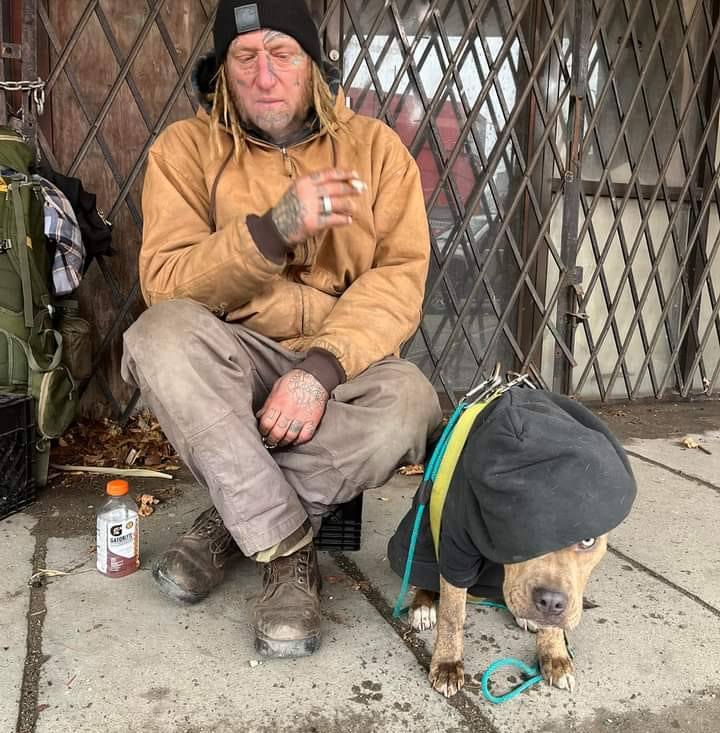 A loved one seated outside with a dog