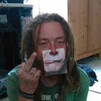 A loved one making a playful gesture with tape over his mouth