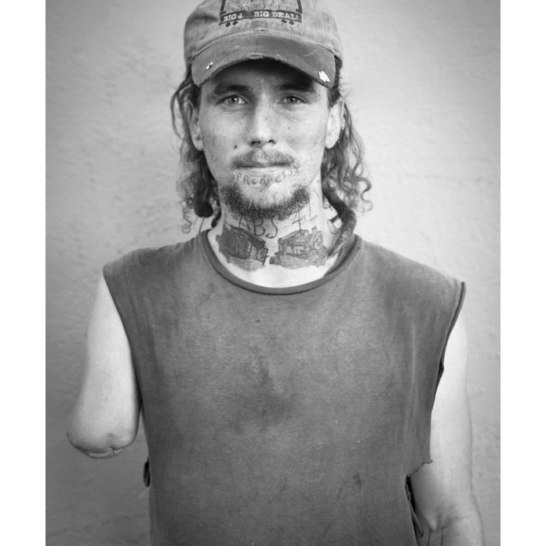 Black and white portrait of Dice Jones wearing a cap